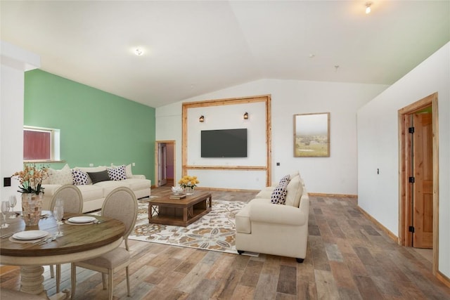 living room with hardwood / wood-style floors and vaulted ceiling