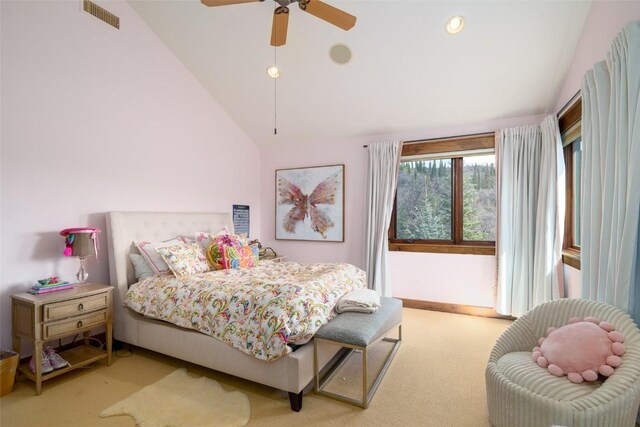 carpeted bedroom with ceiling fan and lofted ceiling