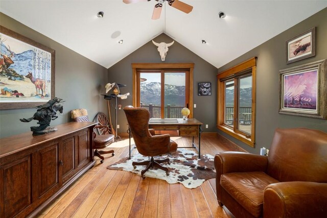 office area with ceiling fan, vaulted ceiling, and light hardwood / wood-style flooring