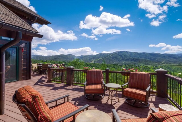 wooden deck featuring a mountain view