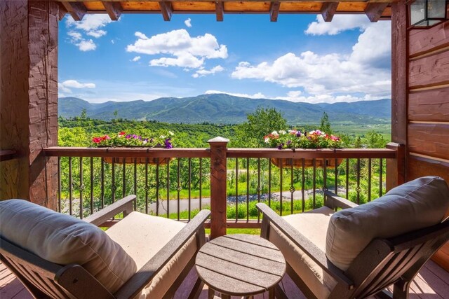 balcony featuring a mountain view