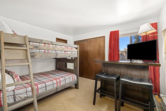 carpeted bedroom with a closet