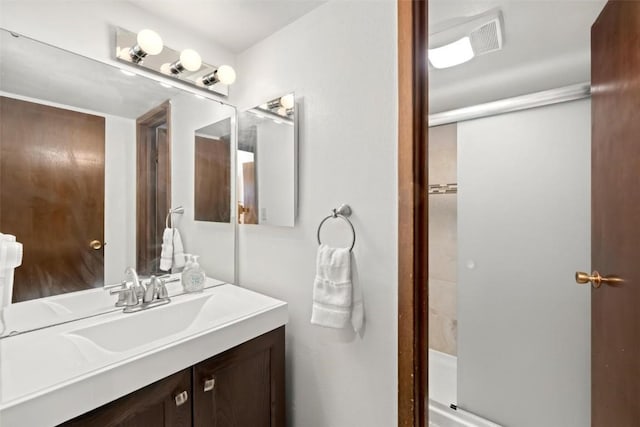 bathroom with vanity and walk in shower