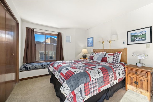 carpeted bedroom with a closet