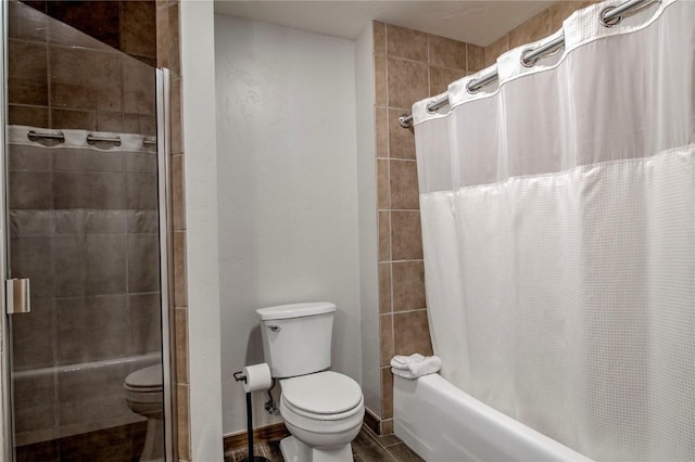 bathroom with shower / bath combination with curtain and toilet