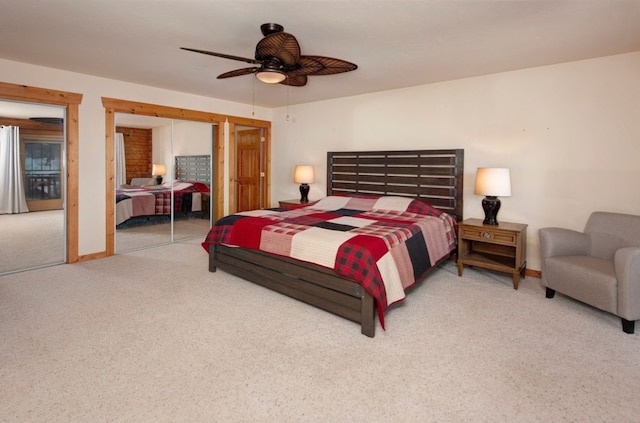 bedroom featuring multiple closets, carpet floors, and ceiling fan