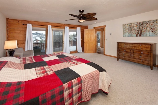 carpeted bedroom with access to outside and ceiling fan