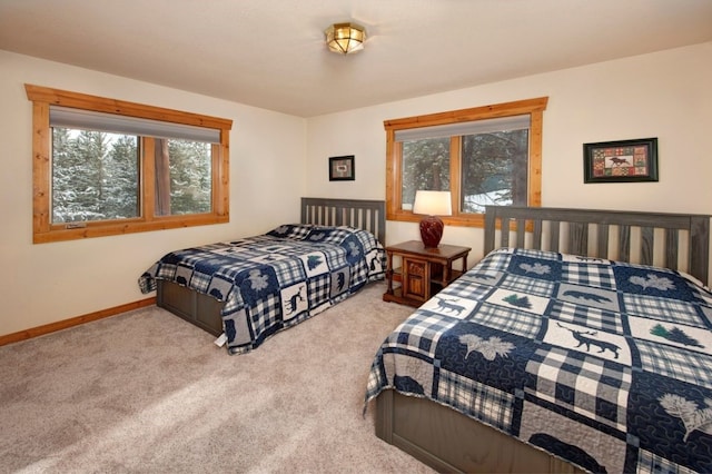 bedroom featuring light carpet