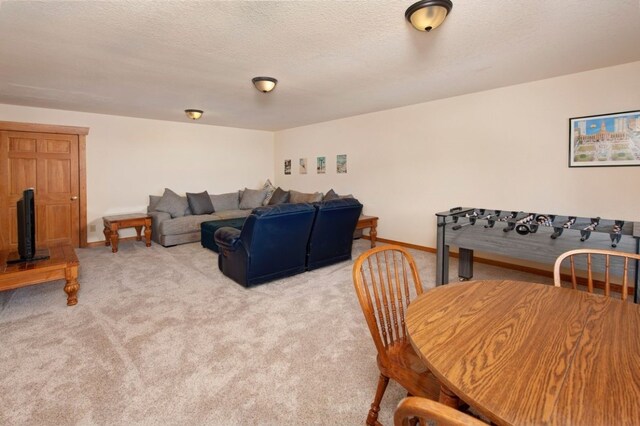 carpeted living room with a textured ceiling