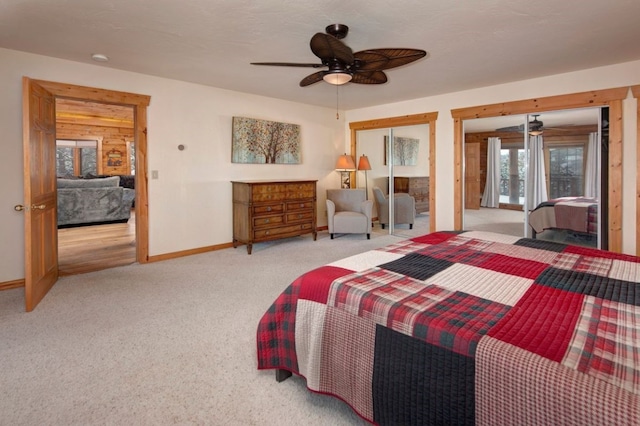 bedroom featuring ceiling fan and light carpet