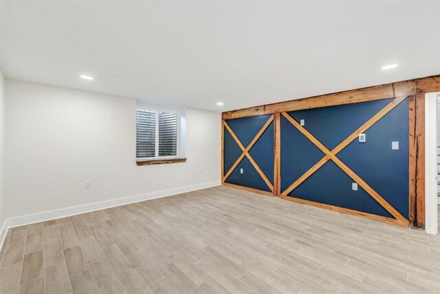 basement featuring light hardwood / wood-style flooring