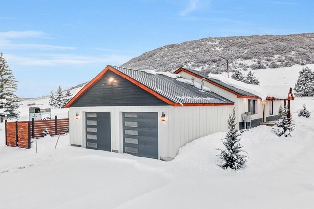 exterior space with a mountain view and a garage