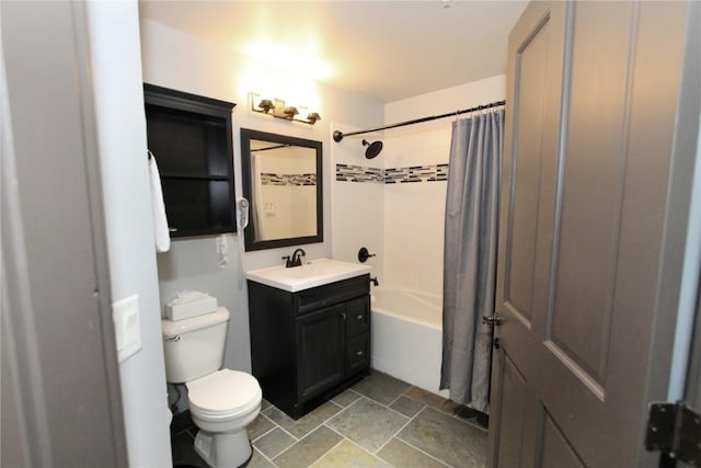 bathroom featuring shower / bathtub combination with curtain, stone finish floor, vanity, and toilet