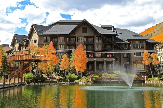 back of property with a water view