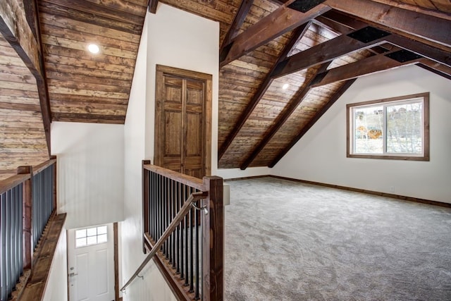 additional living space with baseboards, wood ceiling, beamed ceiling, carpet flooring, and high vaulted ceiling