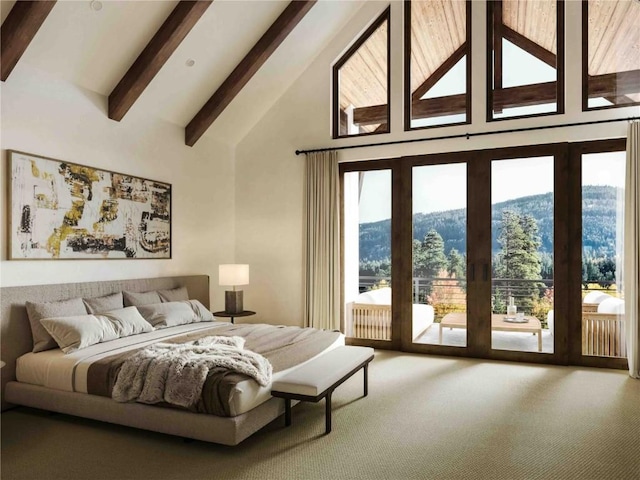 carpeted bedroom featuring access to outside, beamed ceiling, high vaulted ceiling, and a mountain view