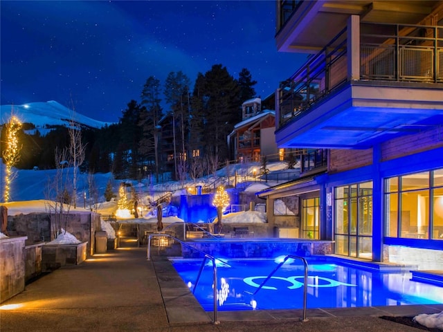 pool at twilight with an outdoor pool