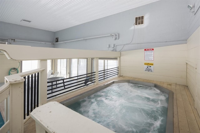 view of pool with an indoor hot tub