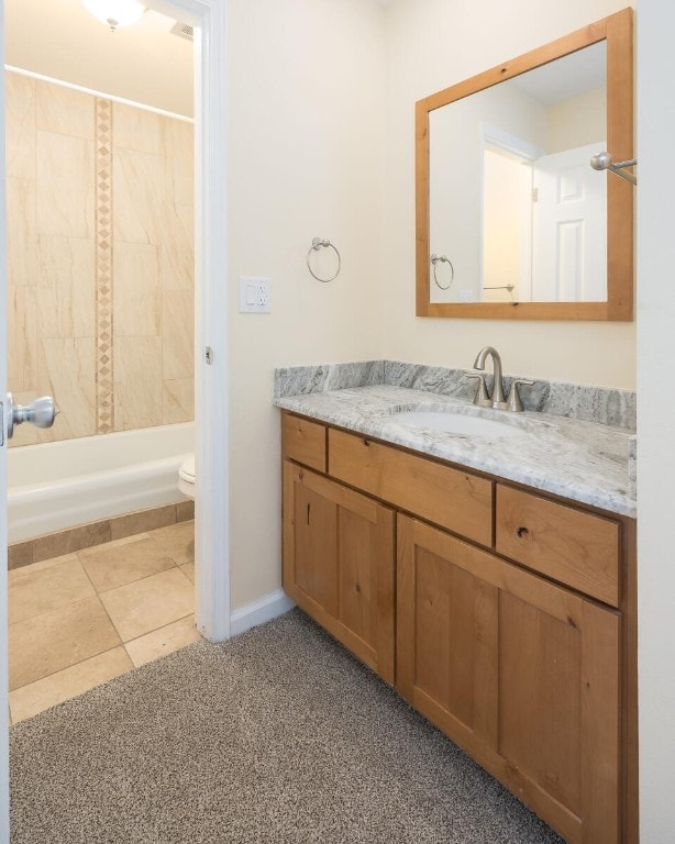 full bathroom with toilet, tile patterned flooring, bathtub / shower combination, and vanity