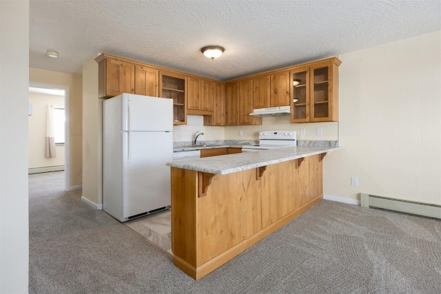 kitchen featuring white appliances, a kitchen breakfast bar, light colored carpet, kitchen peninsula, and a baseboard heating unit