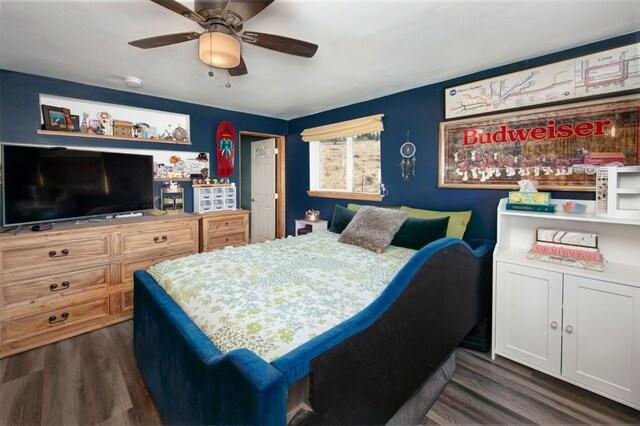 bedroom with ceiling fan and dark wood-type flooring