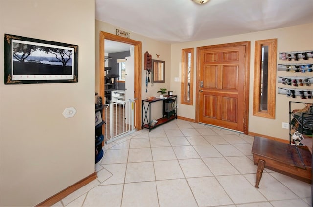 foyer entrance with light tile patterned floors