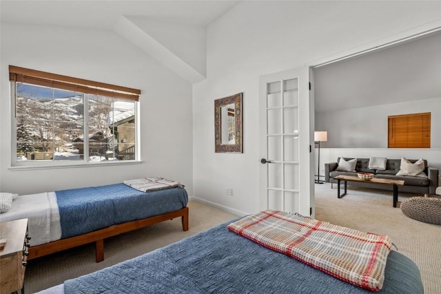 bedroom with lofted ceiling and carpet flooring