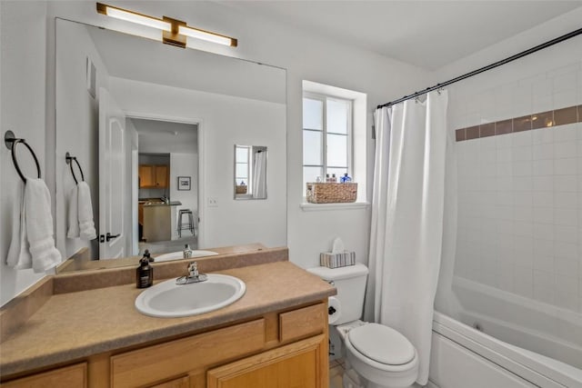 full bathroom featuring vanity, shower / tub combo with curtain, and toilet