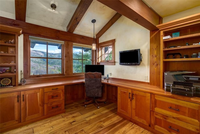 office with vaulted ceiling with beams, light hardwood / wood-style floors, and built in desk