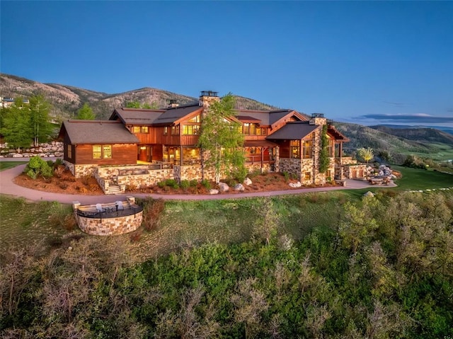 back of house featuring a mountain view