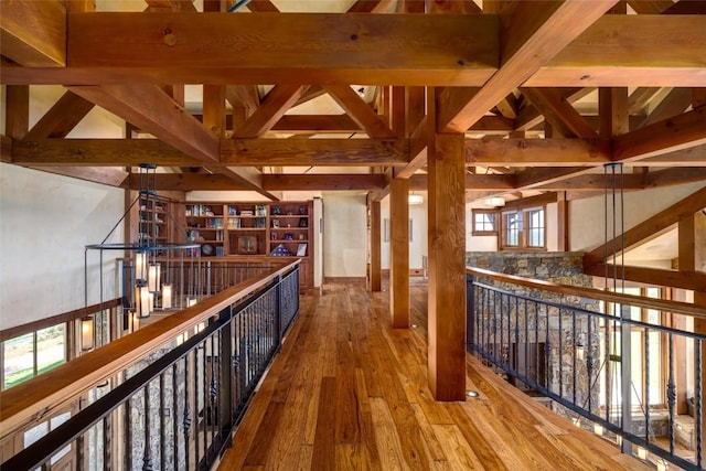 hallway featuring beam ceiling and wood-type flooring