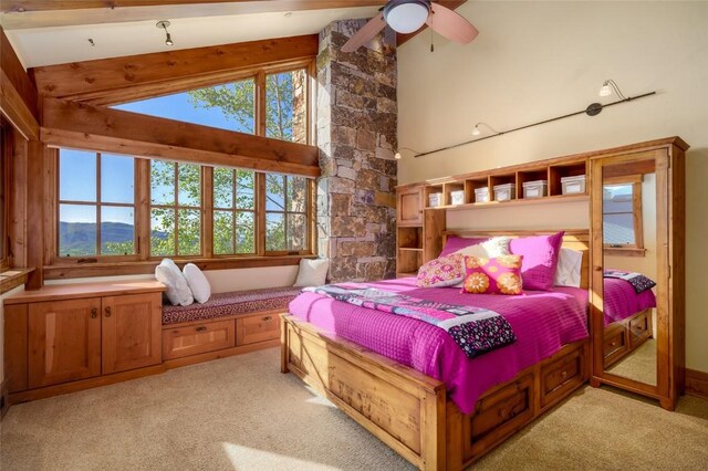 bedroom featuring ceiling fan, light colored carpet, and high vaulted ceiling