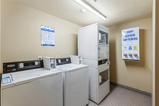 laundry area with light tile patterned flooring, washing machine and dryer, and stacked washer and dryer