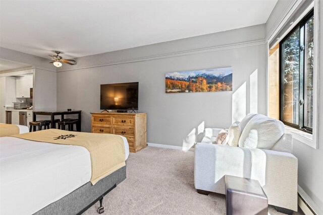 bedroom with ceiling fan and light carpet