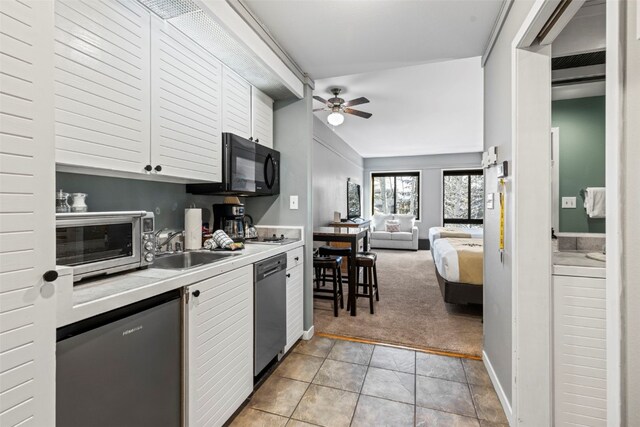 kitchen with light carpet, ceiling fan, dishwasher, and sink