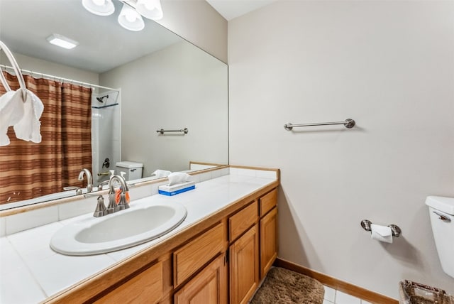 bathroom with curtained shower, tile patterned flooring, vanity, and toilet