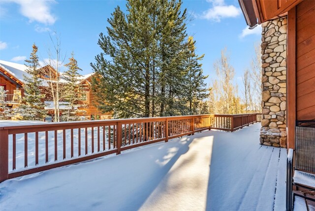 view of snow covered deck