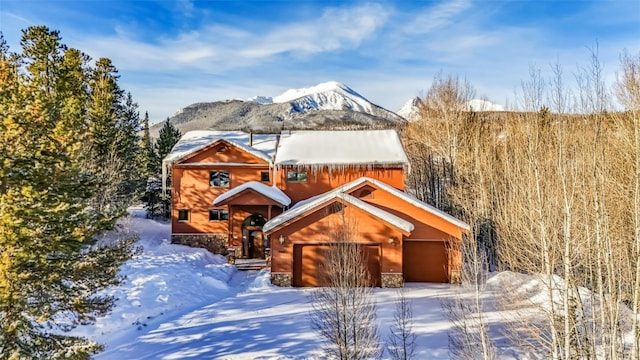 exterior space with a mountain view and a garage