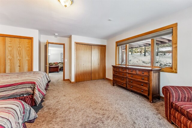 bedroom featuring light colored carpet