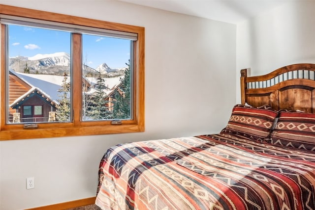 bedroom featuring a mountain view