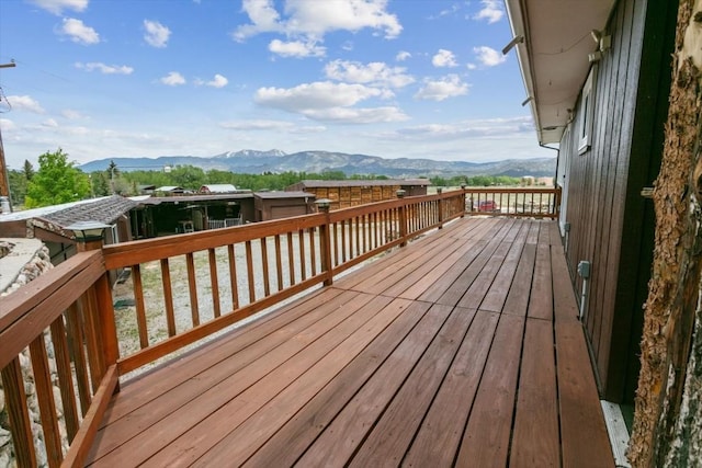 wooden deck with a mountain view