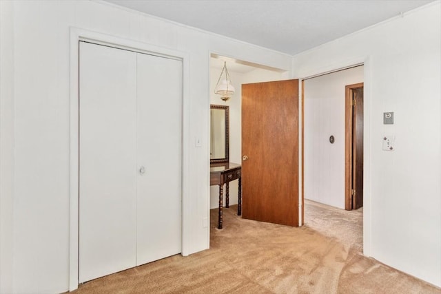 bedroom featuring light colored carpet