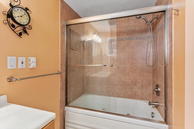 bathroom featuring enclosed tub / shower combo