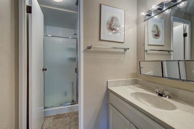 bathroom with vanity and an enclosed shower