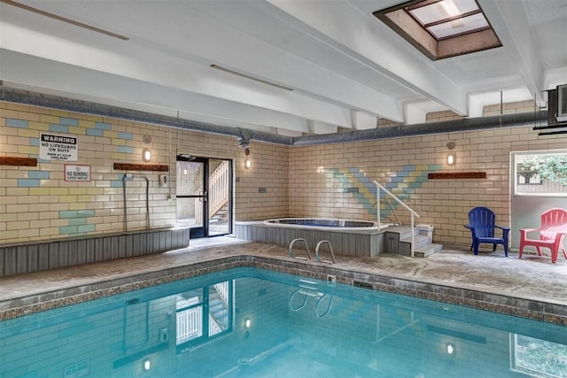 view of pool with a skylight