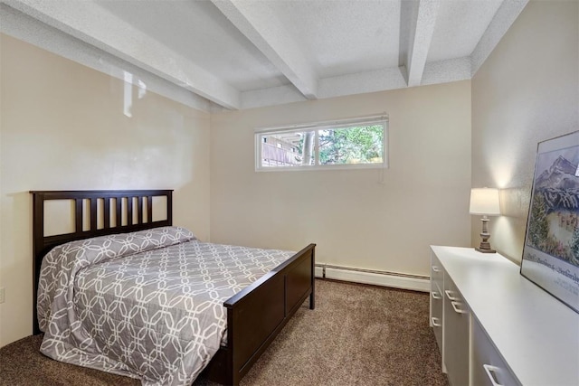 bedroom featuring beam ceiling, dark carpet, and a baseboard heating unit