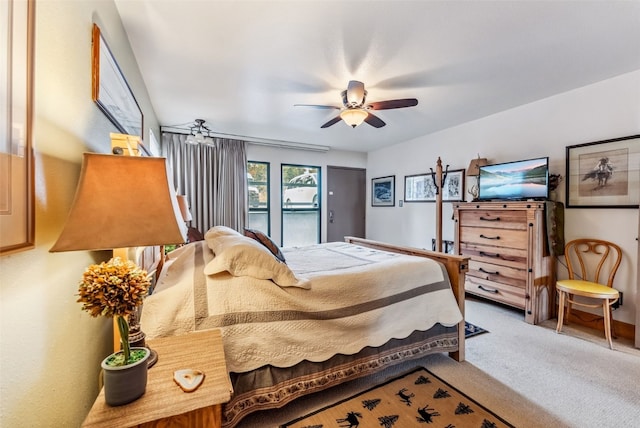 bedroom featuring carpet flooring, ceiling fan, and access to outside