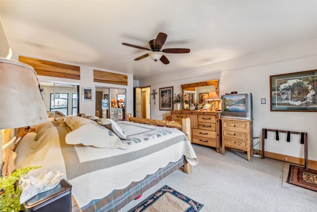 bedroom featuring ceiling fan and light carpet