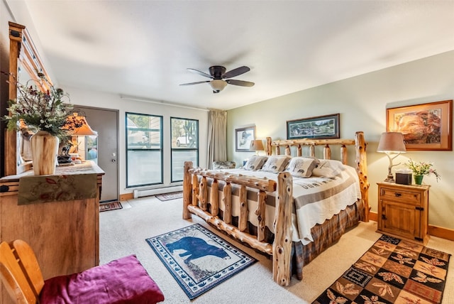 bedroom featuring access to outside, ceiling fan, light carpet, and a baseboard heating unit