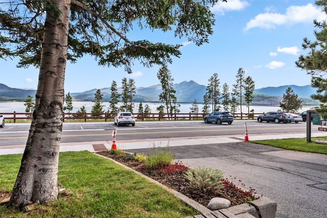 view of street featuring a water and mountain view